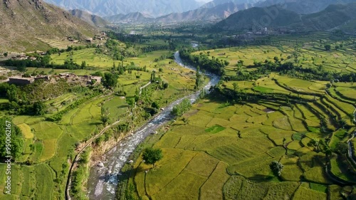 Drone View of Kunar Valley with Kunar River and Vibrant Agricultural Fields in Afghanistan photo