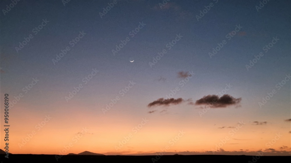 sunset over the sea with a crescent moon sunset over the sea with a crescent moon