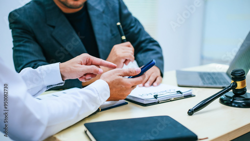 Картината върху платно Two lawyers consult in a modern office, presenting compelling arguments and demonstrating their expertise, trying to win a case with their legal acumen and persuasive skills