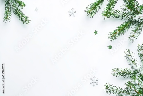 An ornamental frame made from branches of fir trees and ornaments arranged on a pastel gray background representing Christmas, winter, and the new year. Flat lay, top view, copy space.