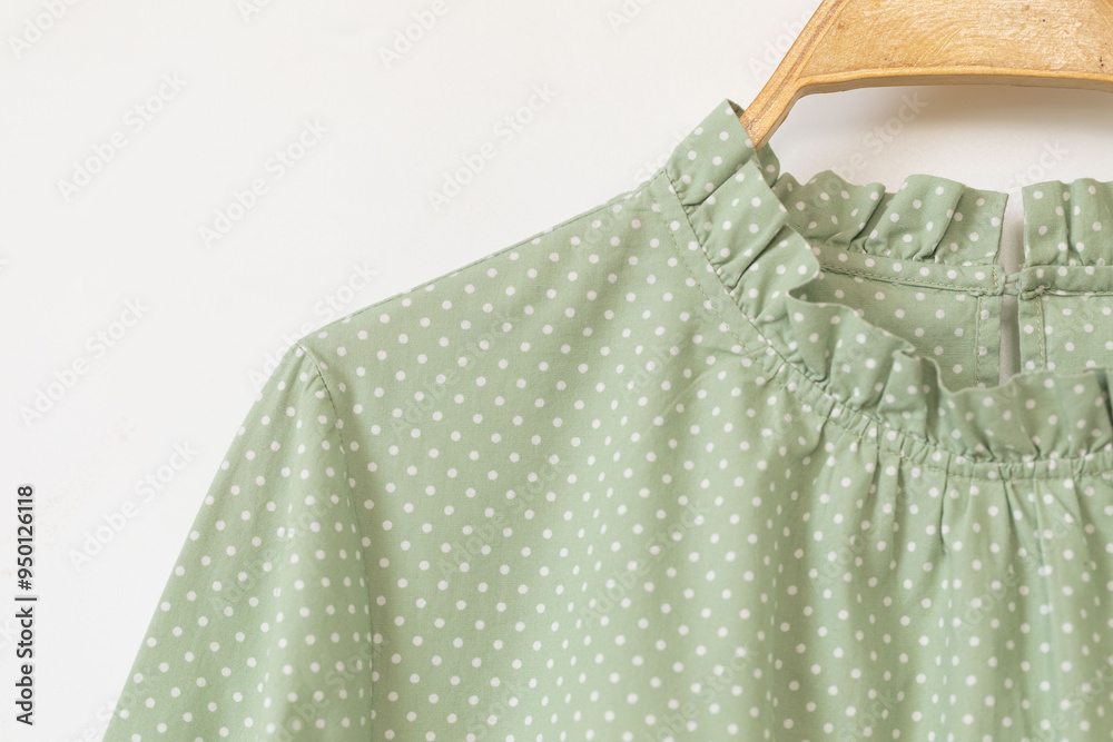 Obraz premium Polka dot dress on a hanger.