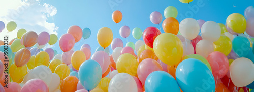 Colorful Balloon Bonanza A Vibrant and Whimsical Showcase of Transparent Balloons Soaring Against a Blue SkyBackdrop photo