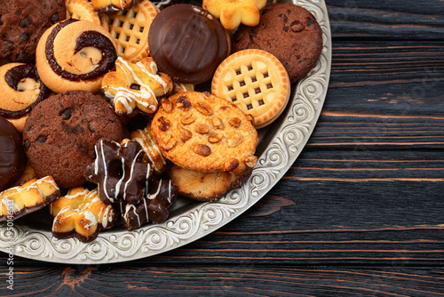 Mix of cookies . Many unhealthy snacks . Top view