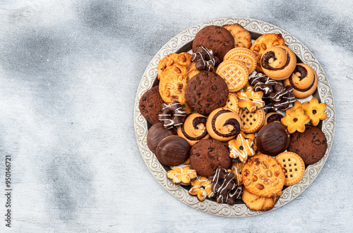 Mix of cookies . Many unhealthy snacks . Top view photo