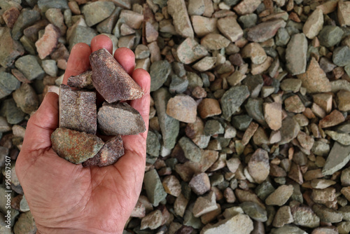 Photography Rare earth (earths) ore held in open hand
