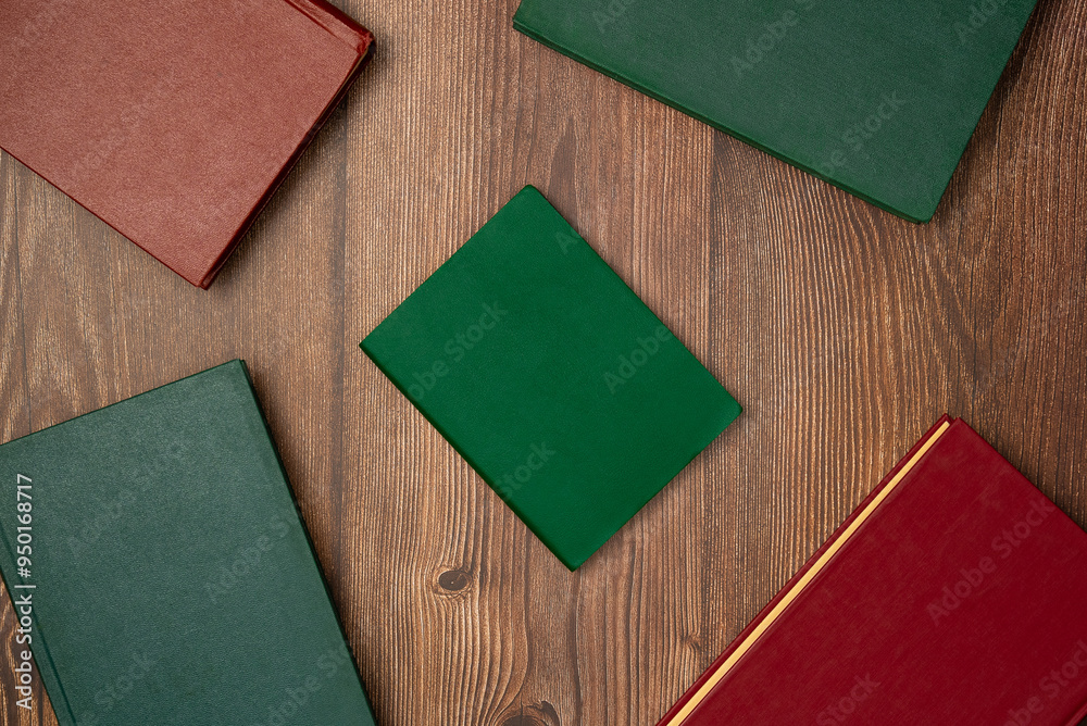 Fototapeta premium Books on wooden background from above. Flat lay, top view.