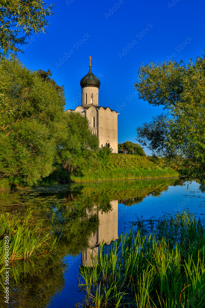 Russia Vladimir region Bogolyubovo Church of the Intercession on the Nerl on a sunny summer day Russia Vladimir region Bogolyubovo Church of the Intercession on the Nerl on a sunny summer day