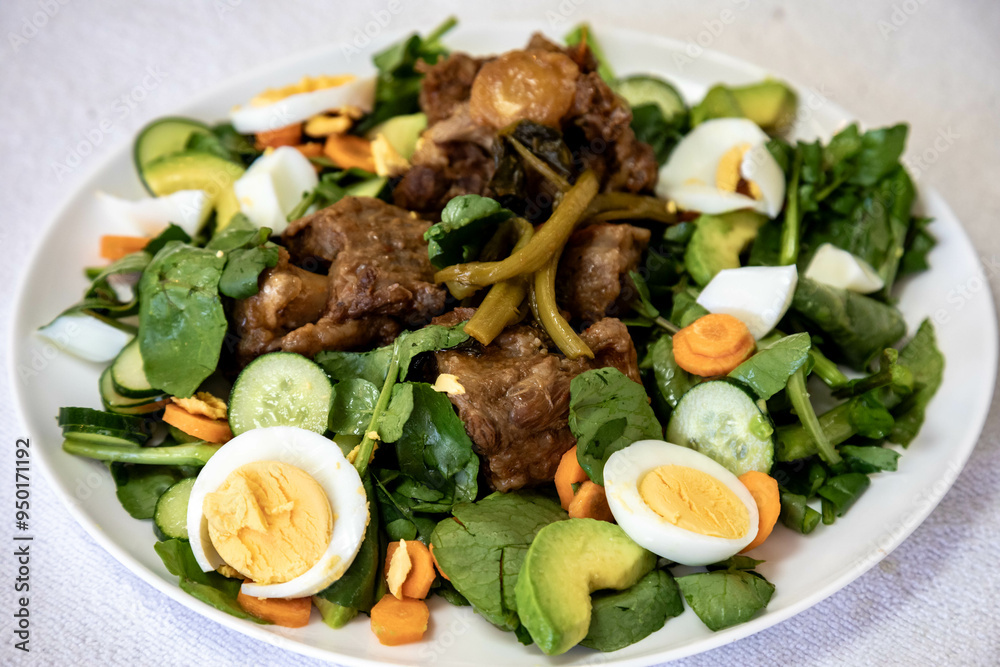 Beef oxtail cooked with watercress and served with salad. Hearty and nutritious low carb food