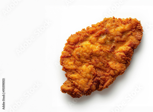 A piece of fried chicken with a lot of seasoning on it