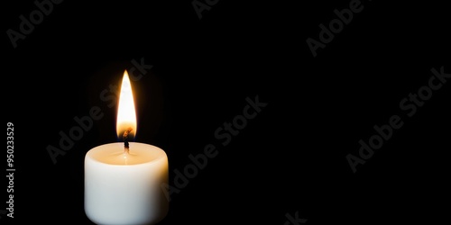 A solitary candle flickering softly in the darkness, casting a warm glow that illuminates a moment of calm reflection and tranquility in an intimate setting. Halloween background, copy space.