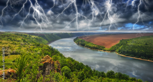 Peaceful view of the canyon Dnister river in a storm. Dramatic landscape with thunderstorm. Powerful lightning over the river. Nature of Ukraine