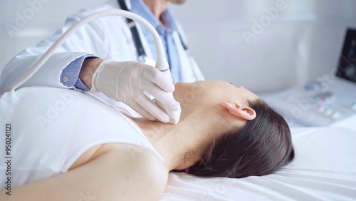 Doctor man is using ultrasound equipment on neck of female patient lying down for a medical examination. Medicine and science