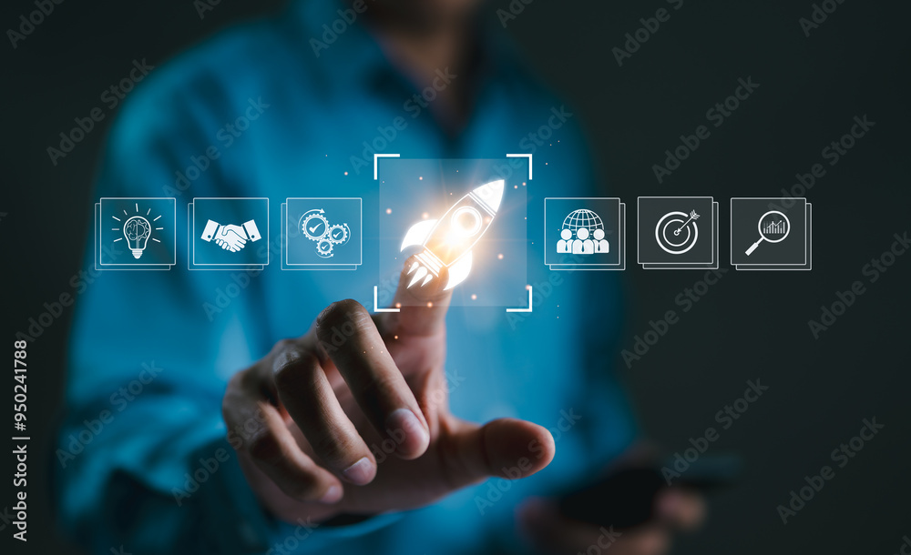 Business Growth and Startup Success Concept. A hand touching rocket icon on digital interface, symbolizing business growth, startup success, innovation, and achieving goals through strategic planning. Business Growth and Startup Success Concept. A hand touching rocket icon on digital interface, symbolizing business growth, startup success, innovation, and achieving goals through strategic planning.