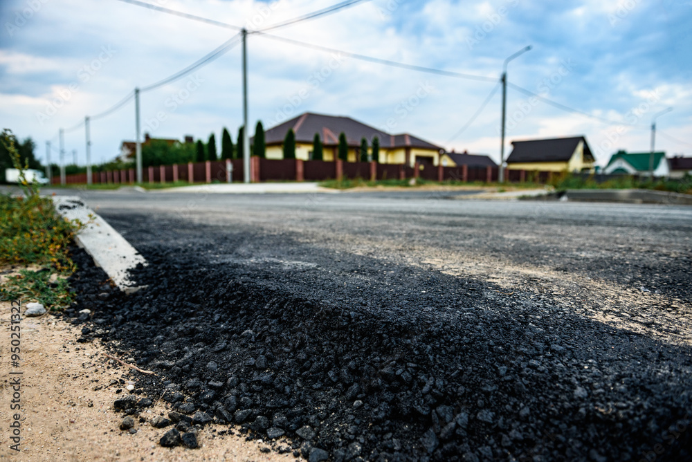 Asphalt road after laying asphalt. New asphalt road renovation. Road construction. Asphalt road after laying asphalt. New asphalt road renovation. Road construction.