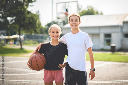 two childs girls in sportswear playing basketball game