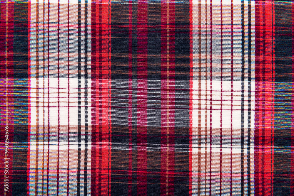 The texture of linen fabric in a large cage of blue, red and white. Scottish tailoring material. Checkered fabric The texture of linen fabric in a large cage of blue, red and white. Scottish tailoring material. Checkered fabric