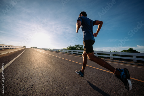 runners is running on the road at outdoors , healthy lifestyle and sport concepts.