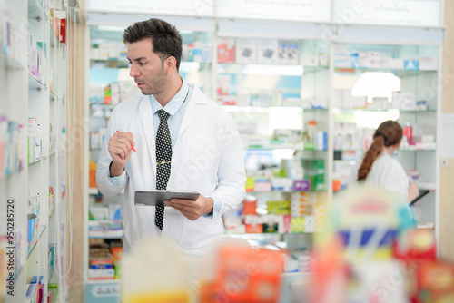 man pharmacist checks and arranges medicines on pharmacy shelves, emphasizing precision and responsibility in healthcare services. The scene highlights the daily operations in a modern pharmacy.