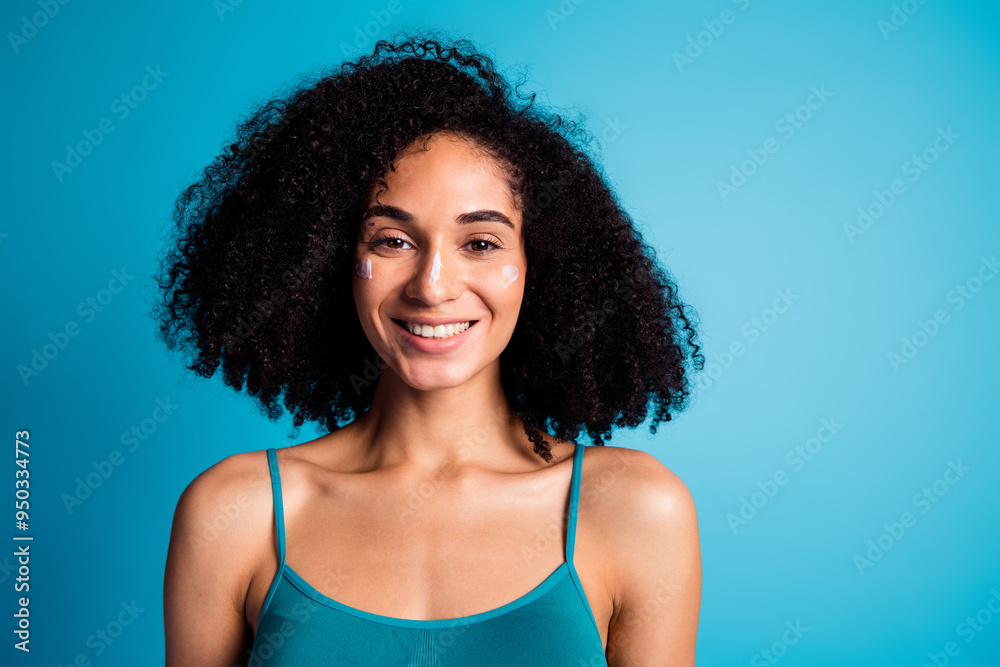 Photo of girl smiling with cream on face enjoying smooth freshness isolated blue color background Photo of girl smiling with cream on face enjoying smooth freshness isolated blue color background