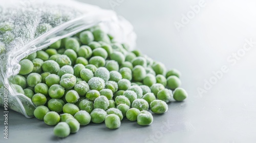 Bag of frozen peas with visible frost on the surface, Frozen legumes, Long-term food preservation