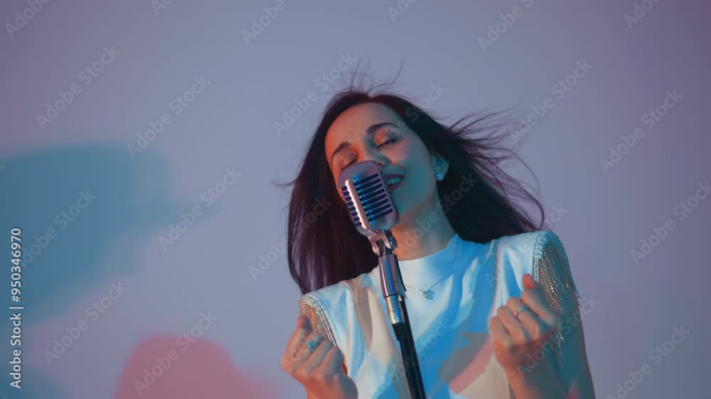 Singer in a white gown performing passionately , hands clasped and eyes closed, expressing deep emotion. Her hair is flowing against a soft gradient background of pink and blue Singer in a white gown performing passionately , hands clasped and eyes closed, expressing deep emotion. Her hair is flowing against a soft gradient background of pink and blue