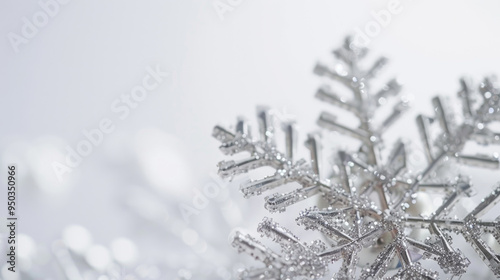 Close-Up of Sparkling Silver Snowflake on a Soft White Background, Perfect for Winter and Holiday Themes