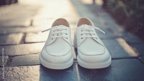 pair of white shoes on a city neutral background