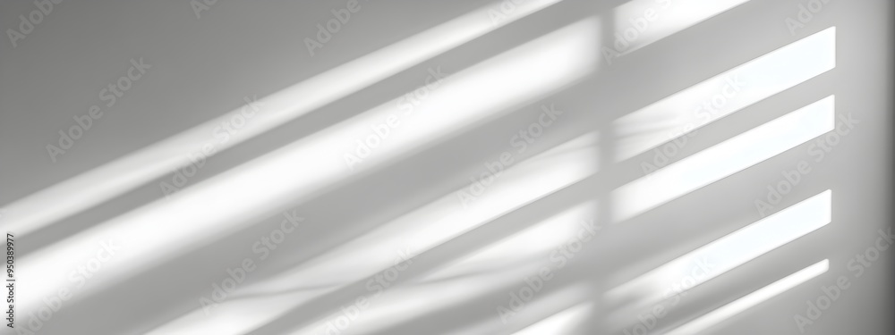 Fototapeta premium Minimal blurred natural light rays casting trace monotone soft shadows on a clean white wall creating a serene calming and elegant abstract composition