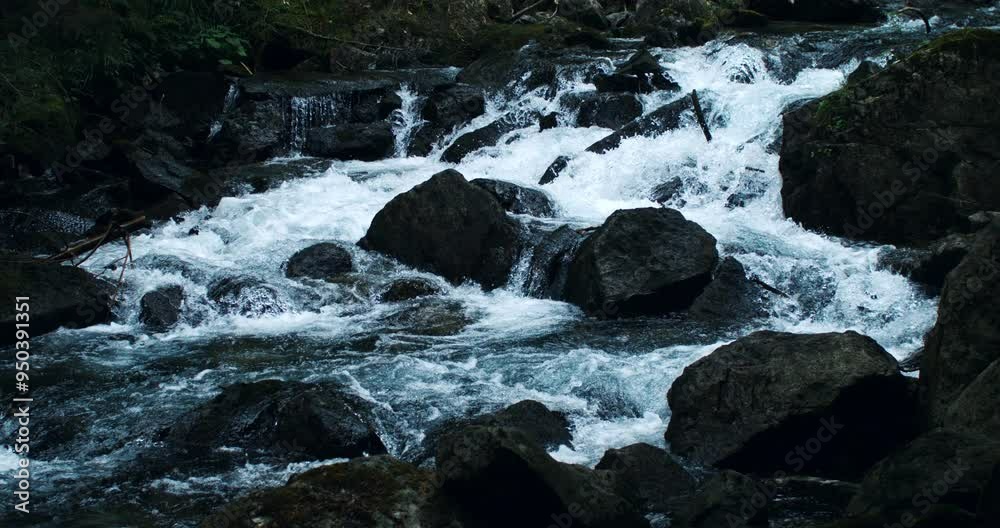 Super slow motion close up of crystal clear pure water ripples flowing stream on fresh natural liquid surface with stones background. Filmed on high speed cinema camera at 1000 fps. Super slow motion close up of crystal clear pure water ripples flowing stream on fresh natural liquid surface with stones background. Filmed on high speed cinema camera at 1000 fps.