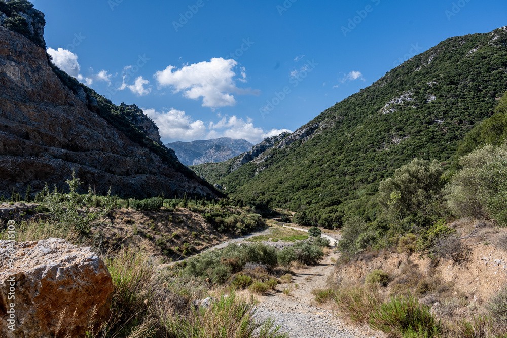 panoramic view of ancient buildings against the backdrop of nature and mountain gardens on a sunny day on the island of Crete in Greece panoramic view of ancient buildings against the backdrop of nature and mountain gardens on a sunny day on the island of Crete in Greece