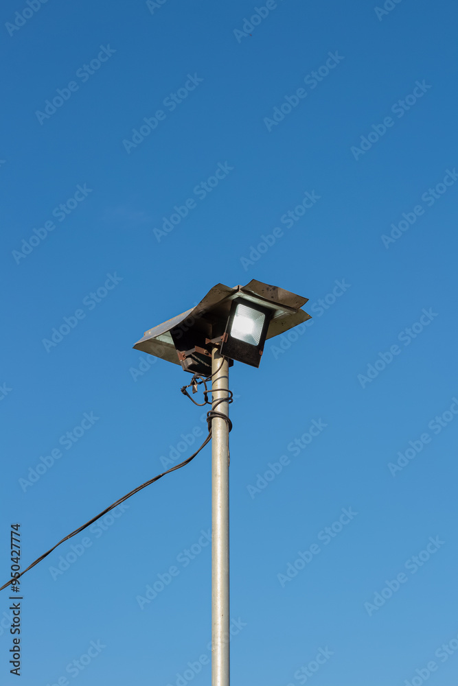 Public street lights with a bright blue sky background Public street lights with a bright blue sky background
