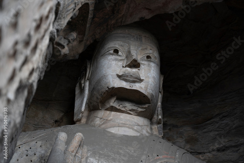 great stone buddhas in Yungang grottoes in Datong,  China photo