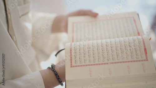 A muslim reading koran in the mosque photo