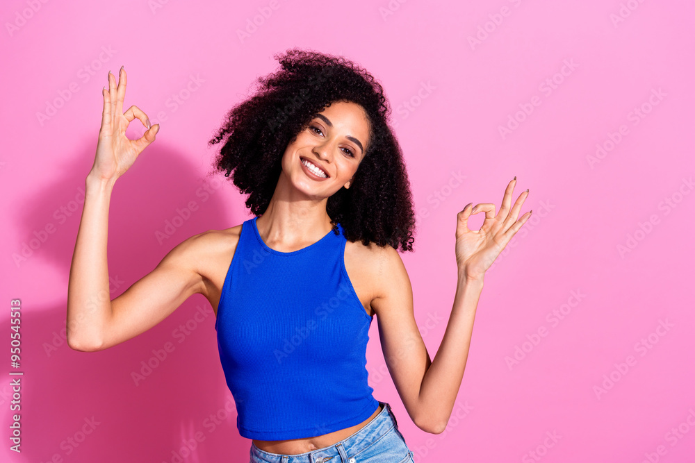 Photo portrait of attractive young woman show okey dressed stylish blue clothes isolated on pink color background Photo portrait of attractive young woman show okey dressed stylish blue clothes isolated on pink color background
