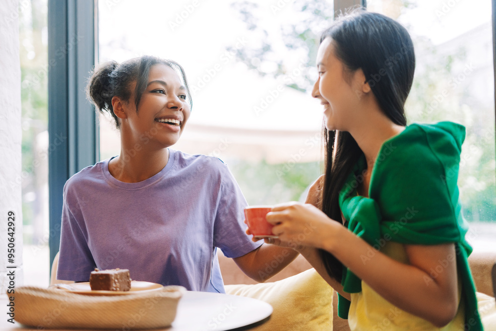 Two female friends sharing a moment together at local coffee shop Two female friends sharing a moment together at local coffee shop