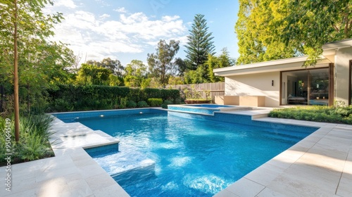 Swimming Pool and Patio with a Modern Home in the Background