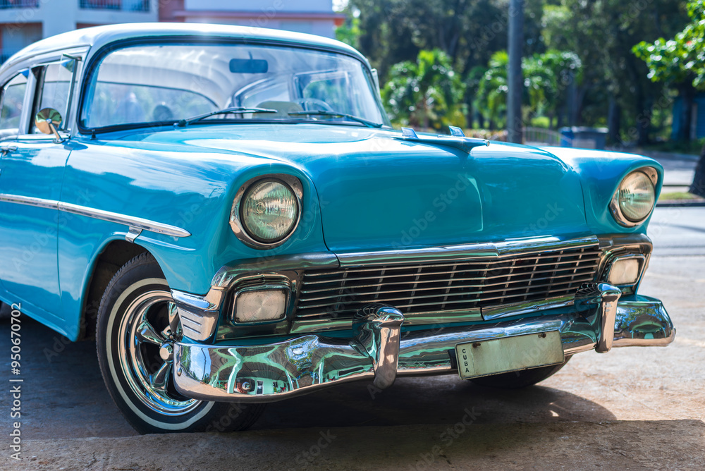 front view of blue classic car on the street of havana cuba front view of blue classic car on the street of havana cuba