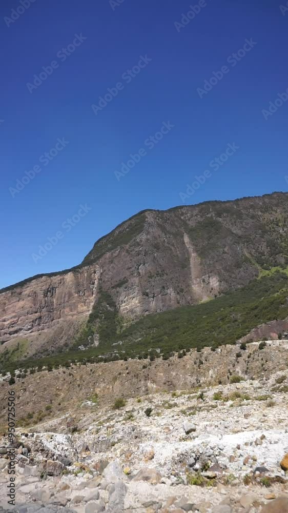 vertical video portrait bright view with the high cliffs of Mount Papandayan which is a stratovolcano in Garut, West Java, Indonesia vertical video portrait bright view with the high cliffs of Mount Papandayan which is a stratovolcano in Garut, West Java, Indonesia