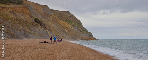 Sea anglers on the overcast Seaton beach, Dorset, UK.
