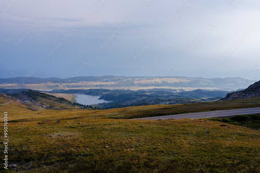 Scenic view of Frozen Lake and the mountains taken from Beartooth Highway in Wyoming during summer. Scenic view of Frozen Lake and the mountains taken from Beartooth Highway in Wyoming during summer.