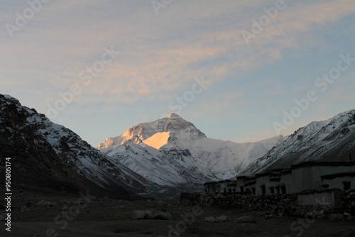 A stunning sunset over the North Face of Mt. Everest, casting a golden glow on the majestic peak.  photo