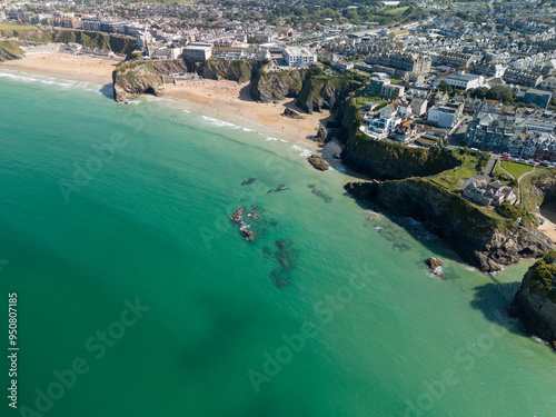 Turquoise atlantic ocean water crashing on newquay beach