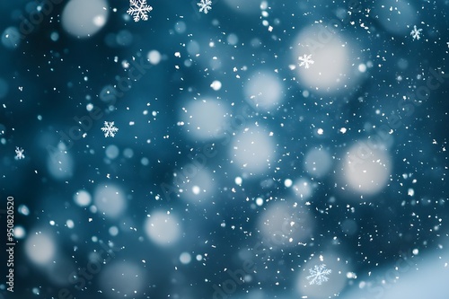 A blue background with snowflakes scattered throughout.For design, print, wallpaper, poster, interior, advertising, banner. With place for text.Winter xmas holiday theme. 