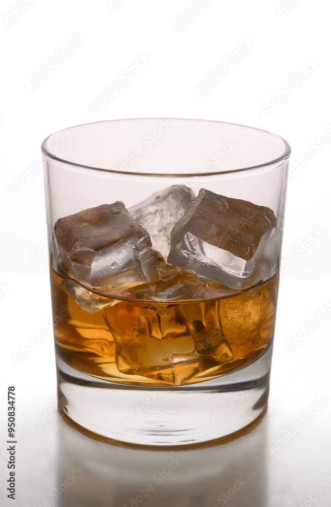 Glass of whiskey with ice cubes Glass of whiskey with ice cubes