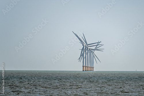Wind turbines at sea. Offshore wind power farm in the North Sea, UK, 27 August 2024