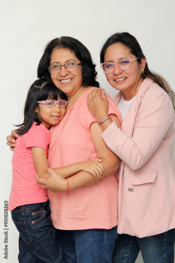 Three generations of brunette Latina women, grandmother, mom and daughter with glasses show their love and family support celebrate Mother's Day Three generations of brunette Latina women, grandmother, mom and daughter with glasses show their love and family support celebrate Mother's Day