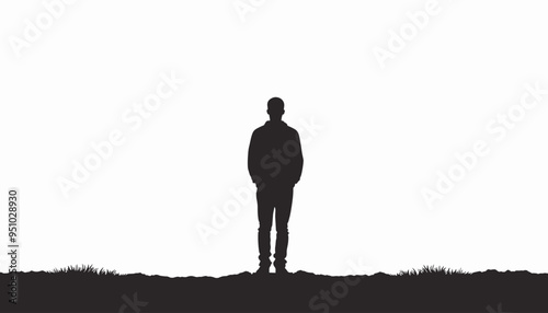 Silhouette of a man standing alone outdoors with a bright background.
