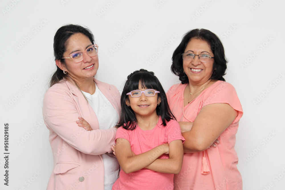 Three generations of brunette Latina women, grandmother, mom and daughter with glasses show their love and family support celebrate Mother's Day Three generations of brunette Latina women, grandmother, mom and daughter with glasses show their love and family support celebrate Mother's Day
