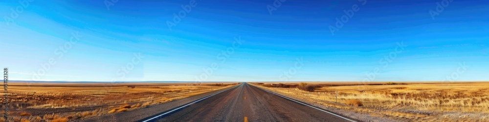 Fototapeta premium A sprawling roadway stretches across the scene under a bright blue sky, inviting endless possibilities and freedom.