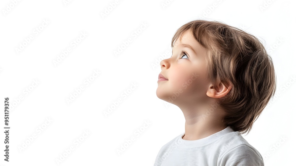 Thoughtful Child Profile in Relaxed Pose Against Clean White Background Thoughtful Child Profile in Relaxed Pose Against Clean White Background